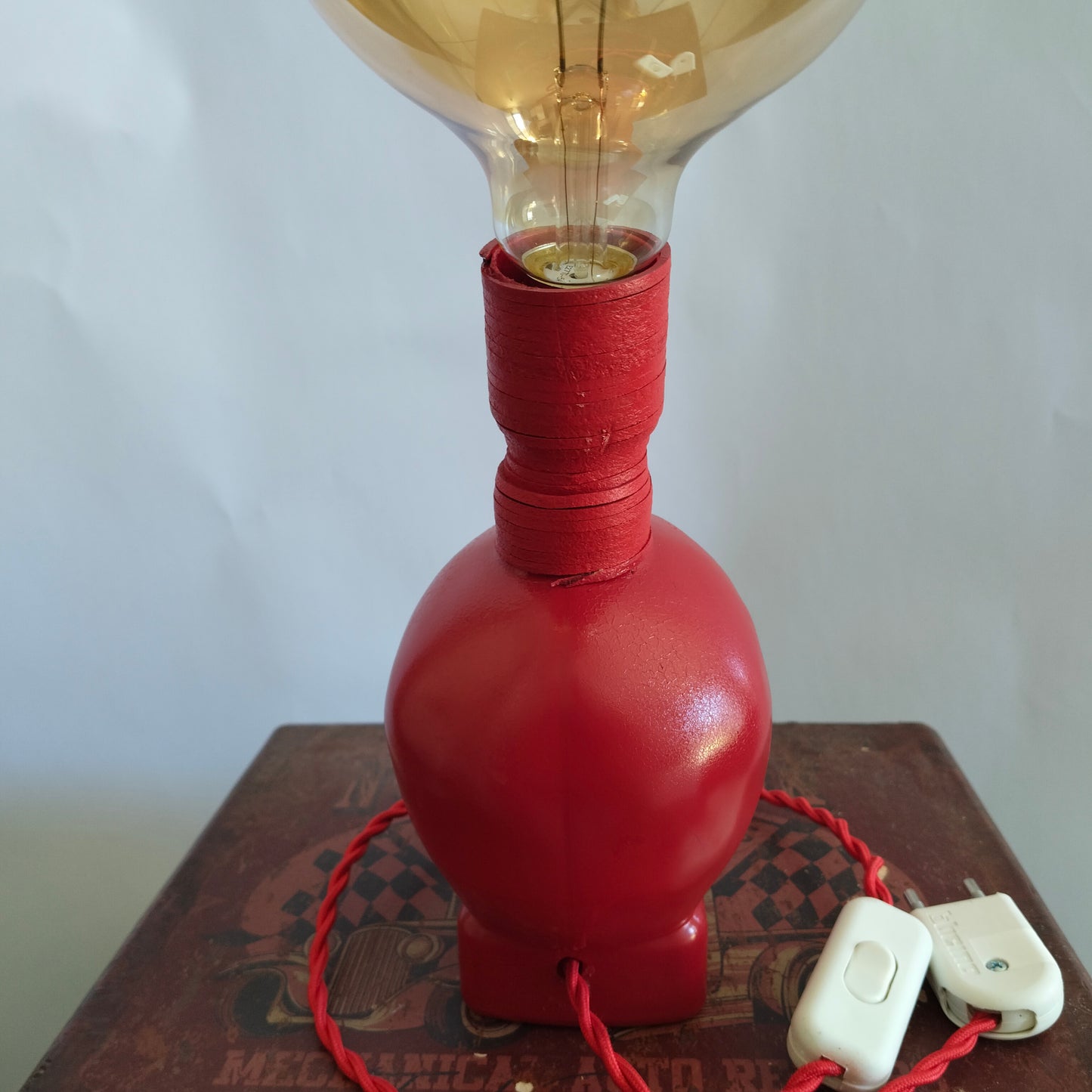 Red skull bottle lamp with suede cord and braided cable