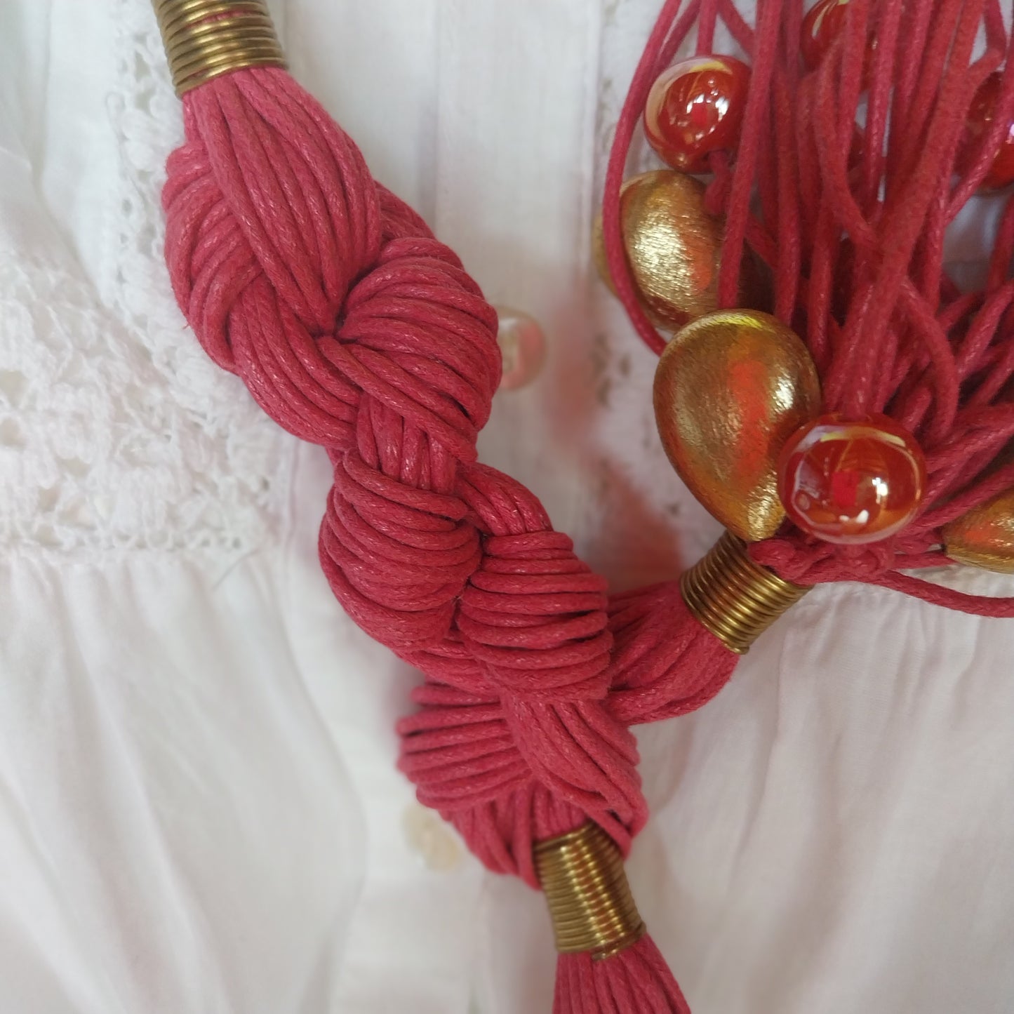 Sustainable artisanal necklace with ceramic beads and golden accents