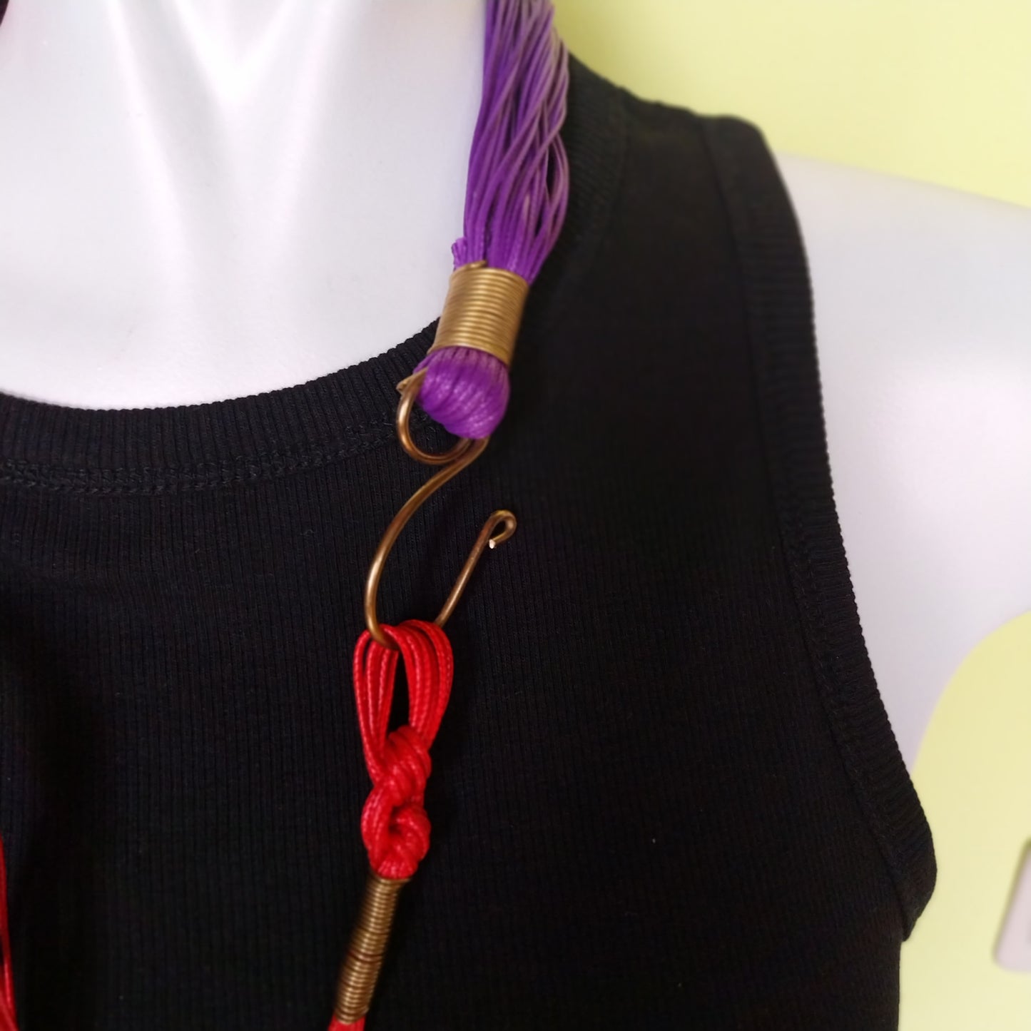 Handmade Spirale Necklace featuring silk tassel and brass clasp