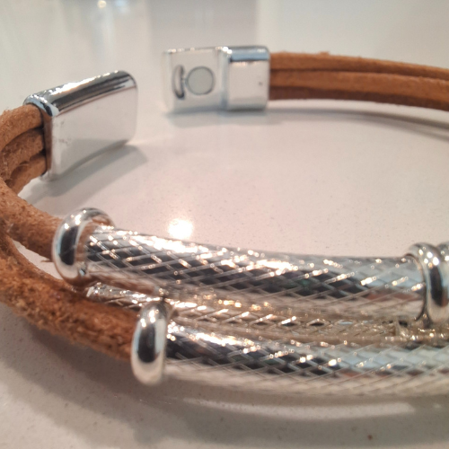 Triple strand raw leather bracelet with polished chrome details
