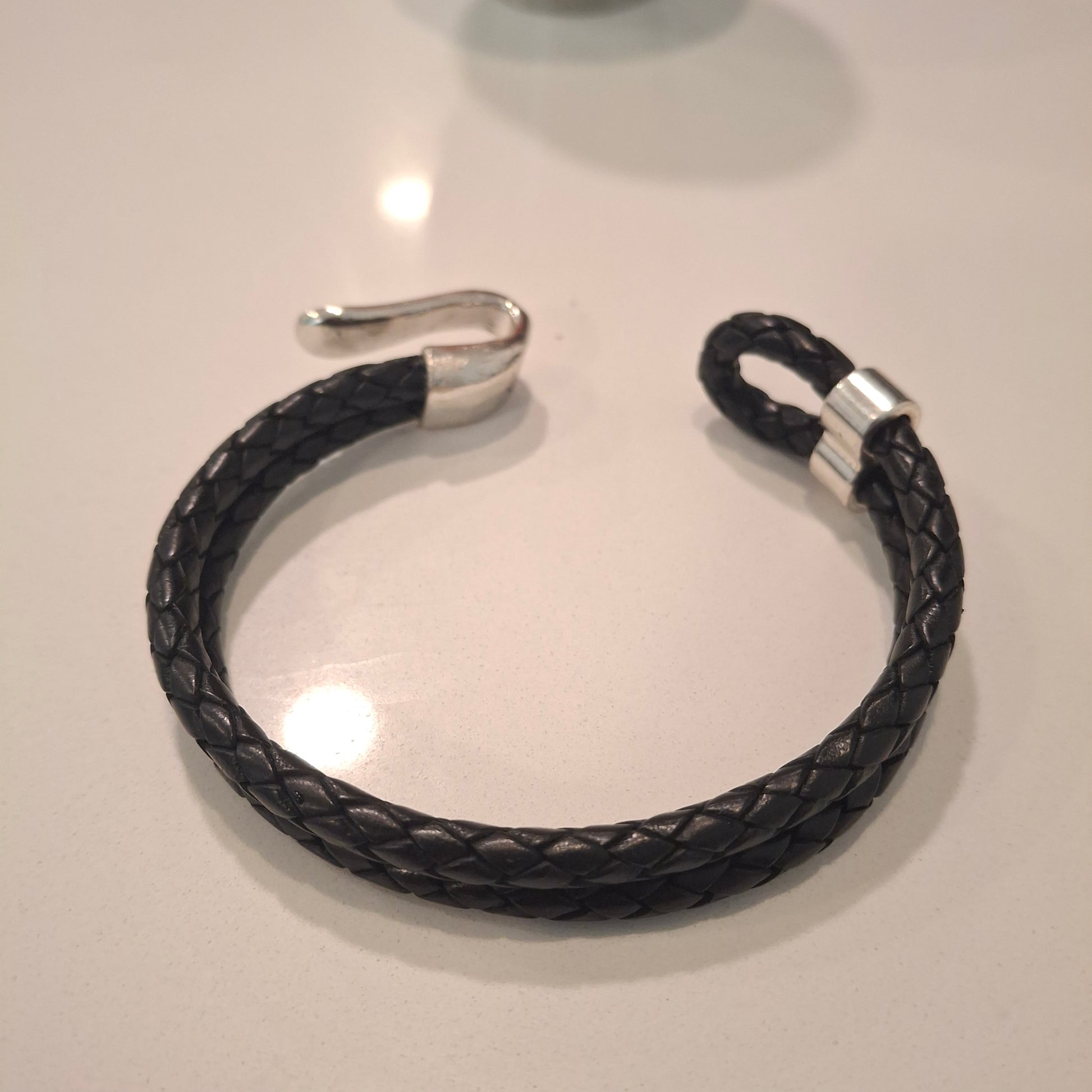 Nautical style black leather bracelet with chrome steel detail