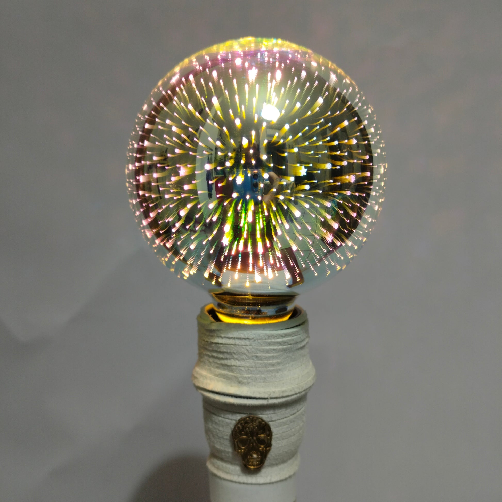 Detail of 3D Fireworks LED bulb creating colorful explosion effect