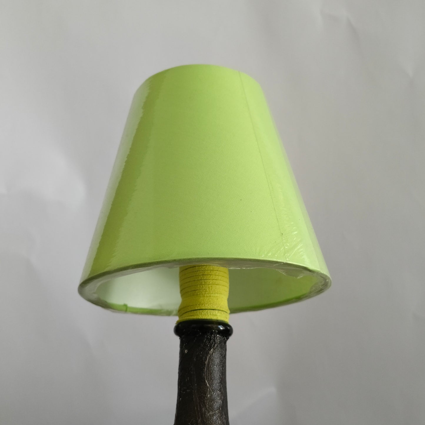 Close-up of the green suede wrap on the lamp holder