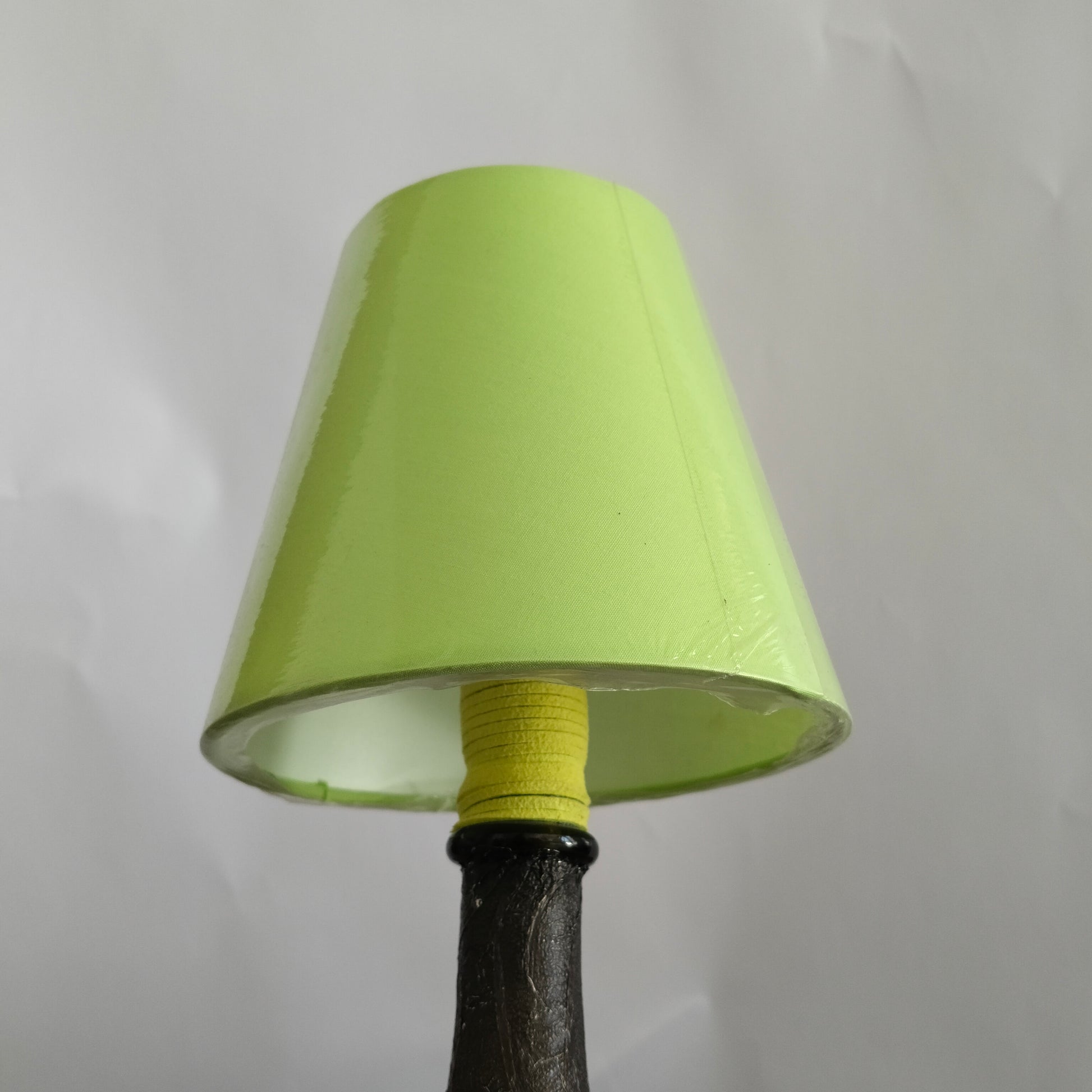 Close-up of the green suede wrap on the lamp holder