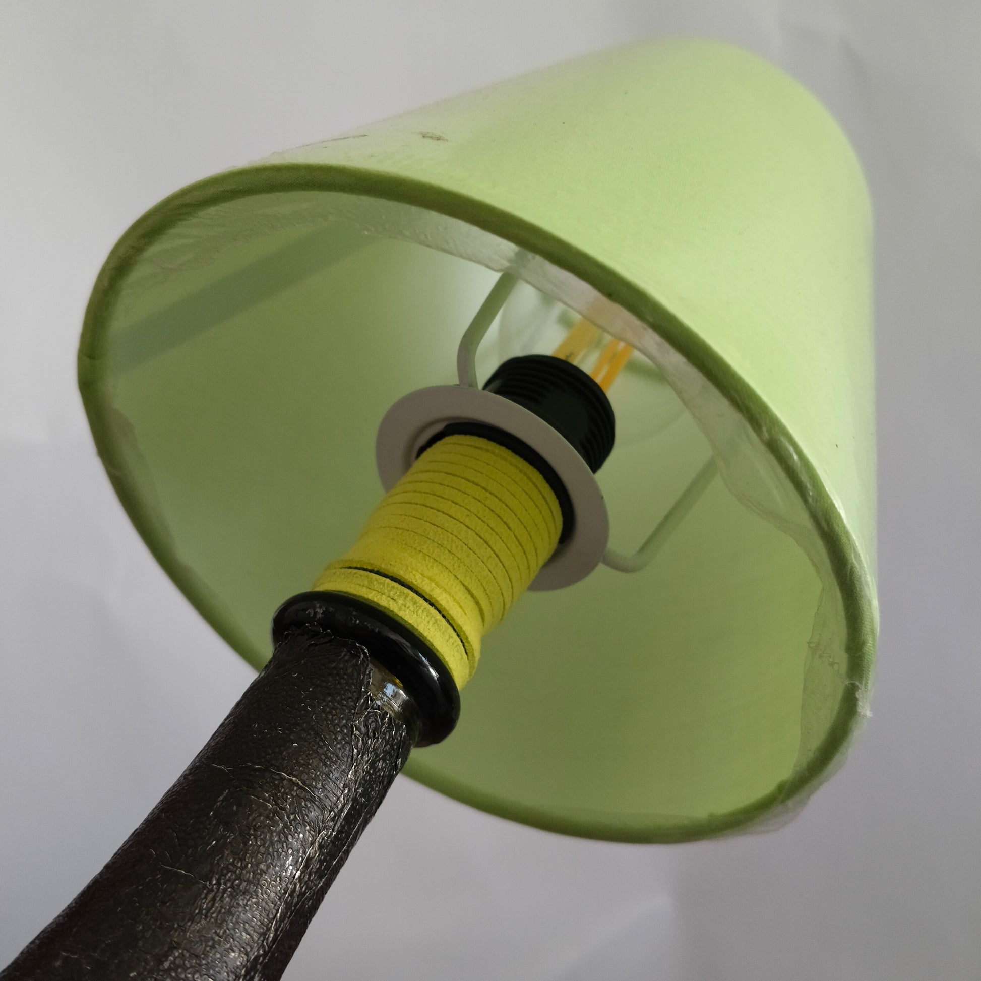 Cable Lamp Patrimony turned on, creating luminous green atmosphere