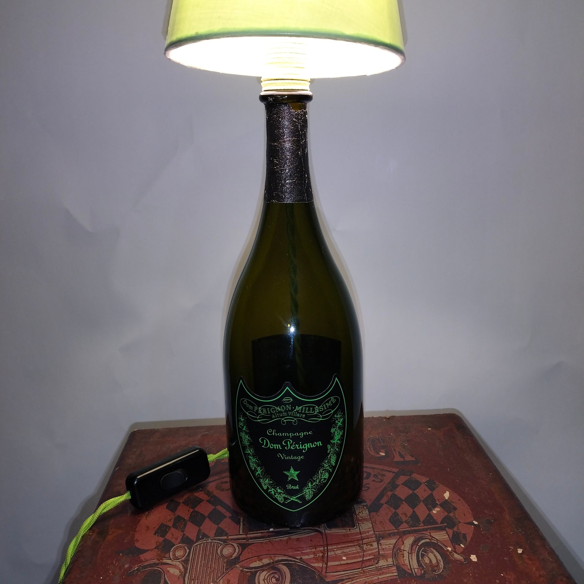 Illuminated Dom Pérignon lamp highlighting luminous label