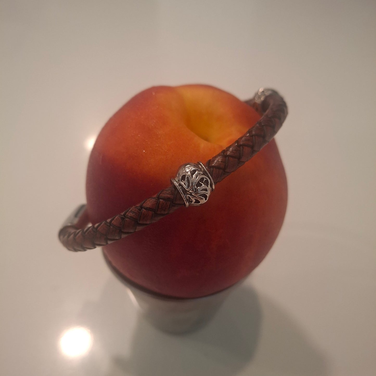 Side view of the handmade woven leather Crown bracelet