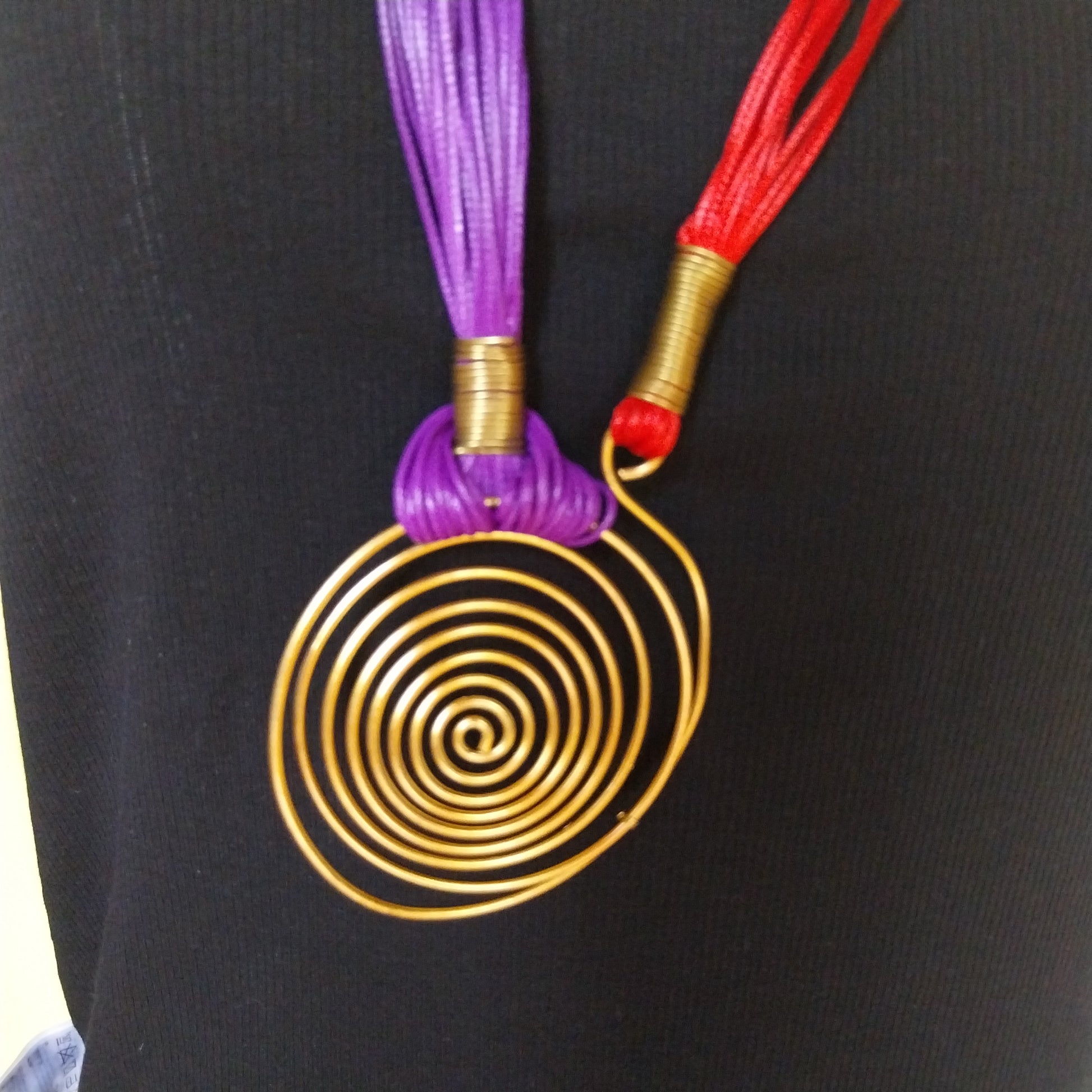 Artisan Spirale Necklace with brass spiral pendant centerpiece